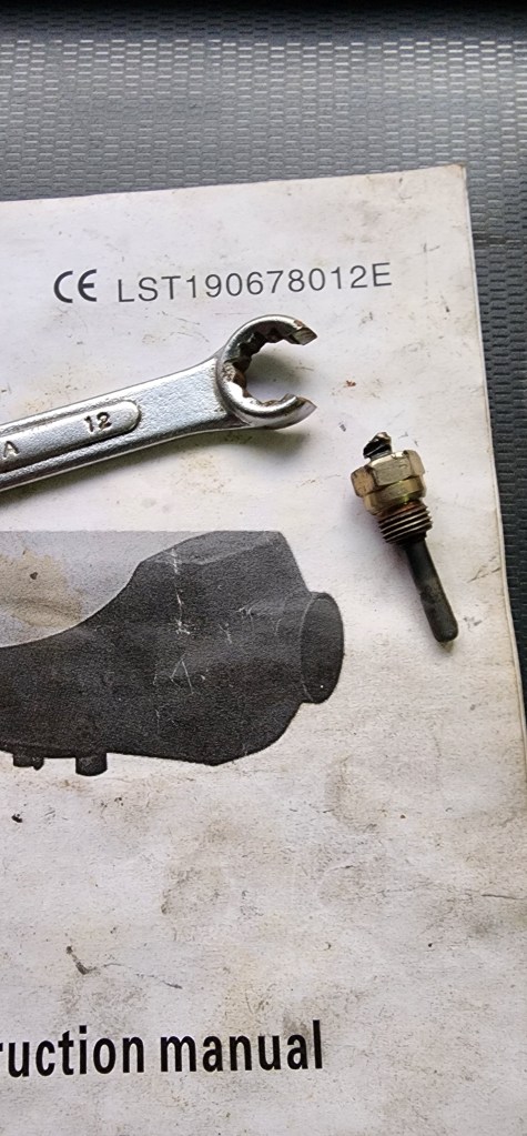 Chinese diesel heater instruction booklet 1 x 12mm ring spanner and a heater glow plug.The spanner was ground away to fit the heater glow plug.